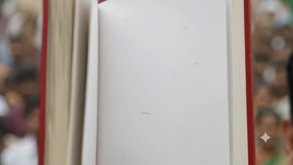 The red book opens to a clean, blank parchment page